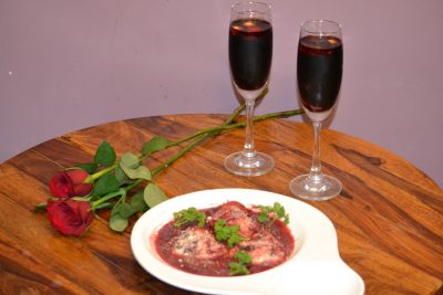 Heart shaped Raviolli with ricotta cheese and beetroot, in beetroot sauce